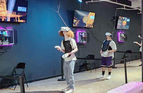 Players experiencing VR Haunted Houses in Des Moines, IA, at The White Rabbit VR Arcade, immersed in thrilling virtual reality horror adventures